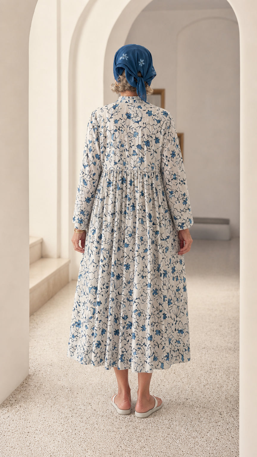 Back full-length view of Blue & White floral midi dress showing gathered smock back