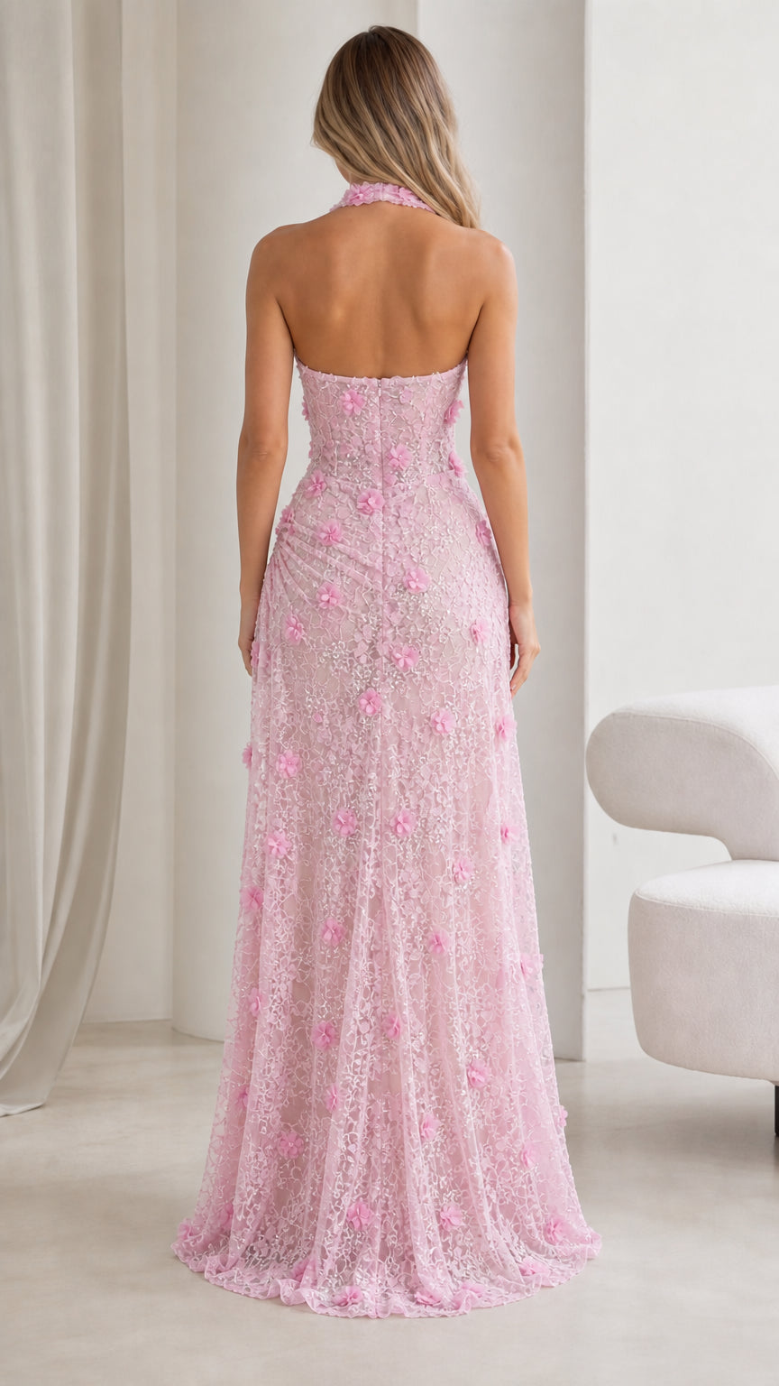 Back view of blush pink halter maxi dress with open back detail