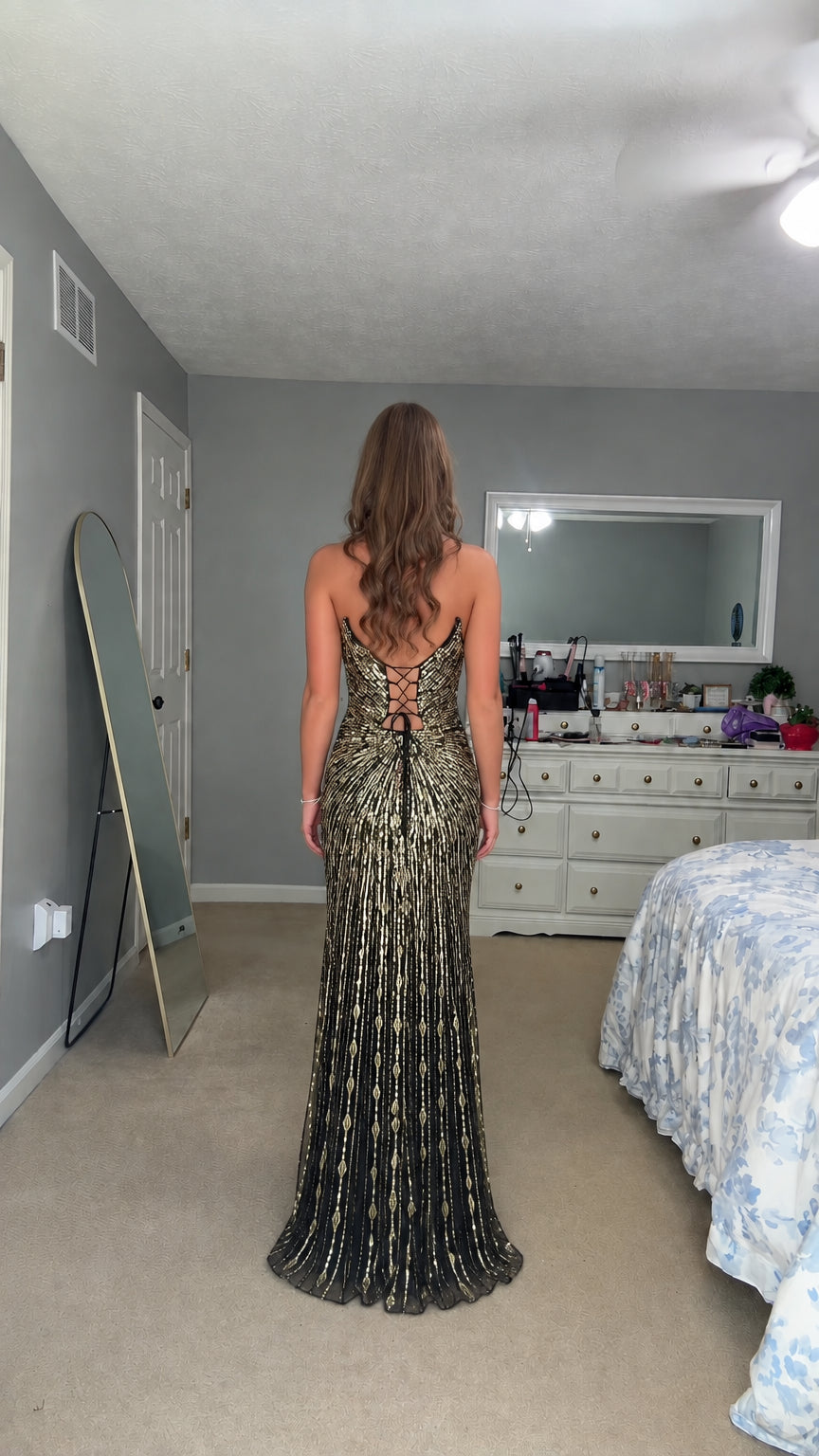 Back view showcasing the lace-up corset back of the sequin evening gown