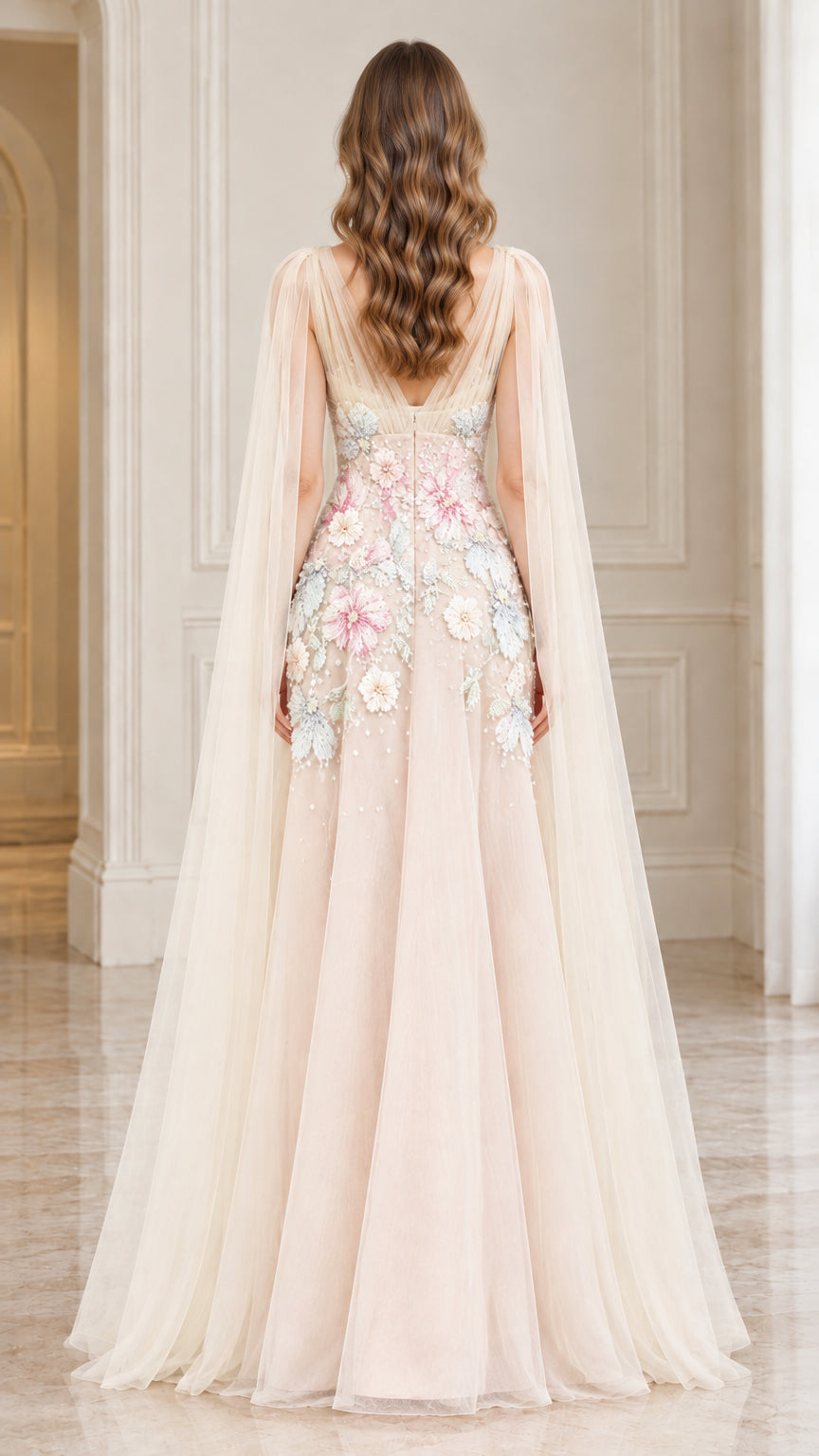 Back view of Champagne A-line evening gown with illusion V-back and cape detail