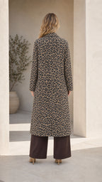 Back view of woman wearing Classic Tan longline leopard print coat
