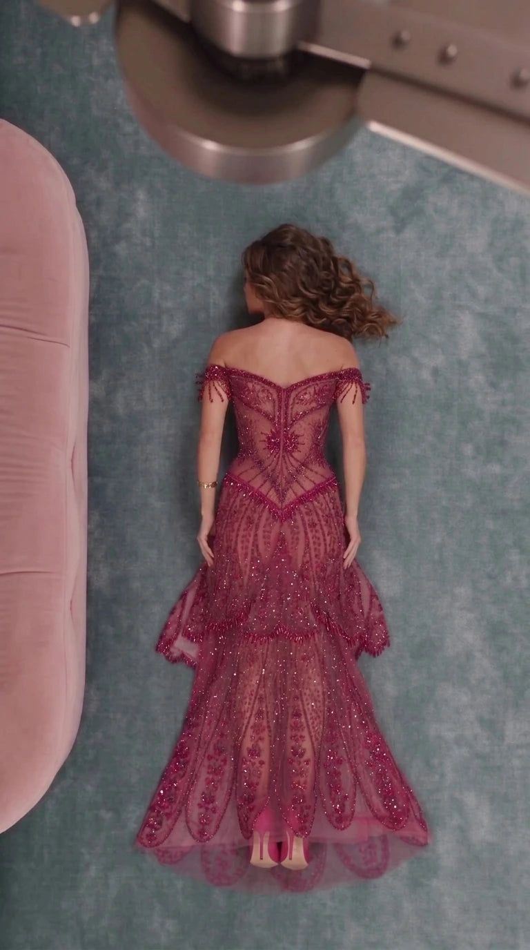 Back view of burgundy beaded off-the-shoulder evening gown