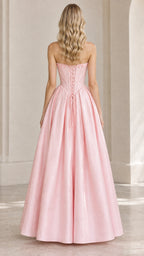 Back view of model showing lace-up corset back on pink formal gown