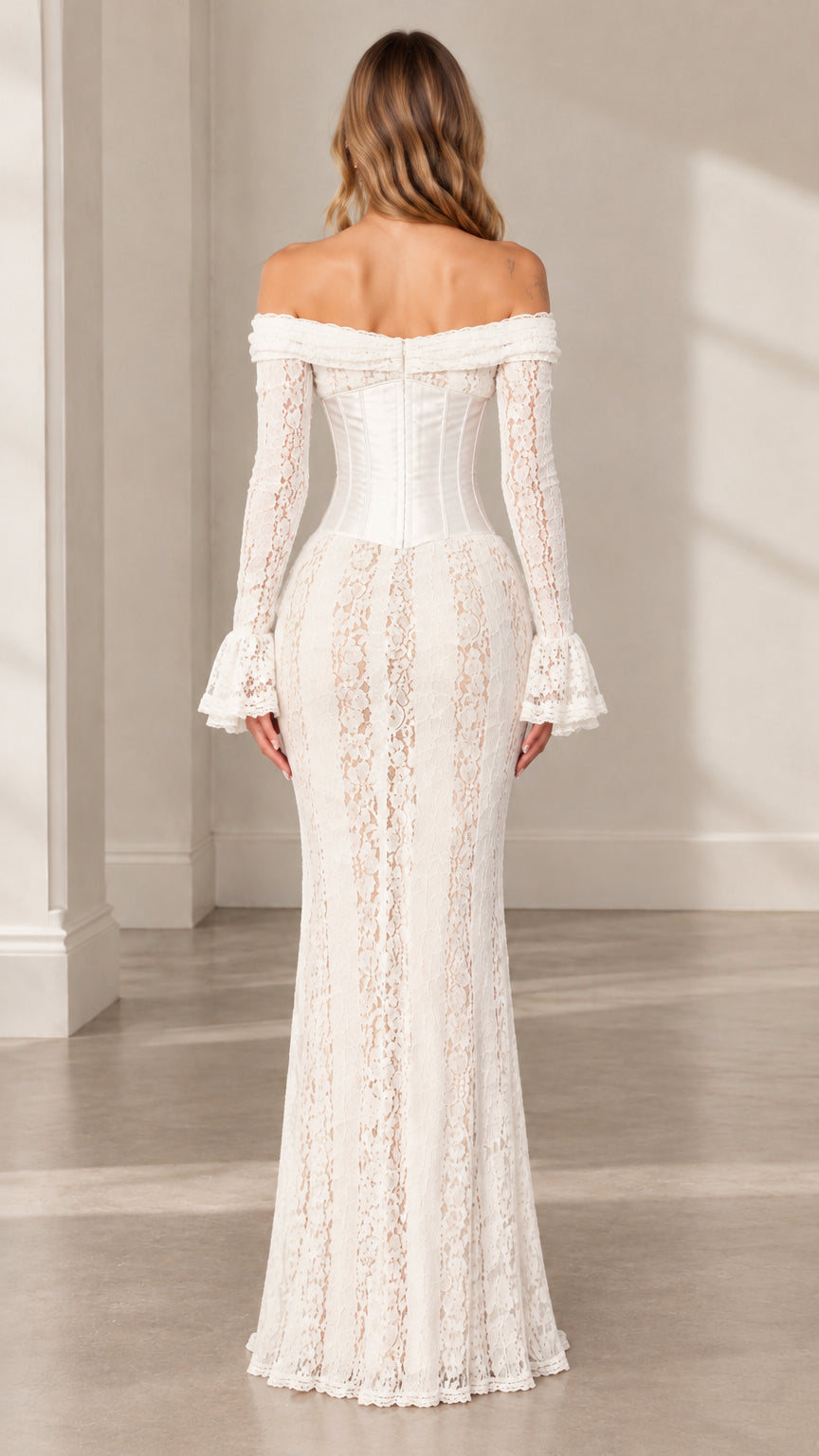 Back view of woman wearing white off-the-shoulder lace corset maxi dress