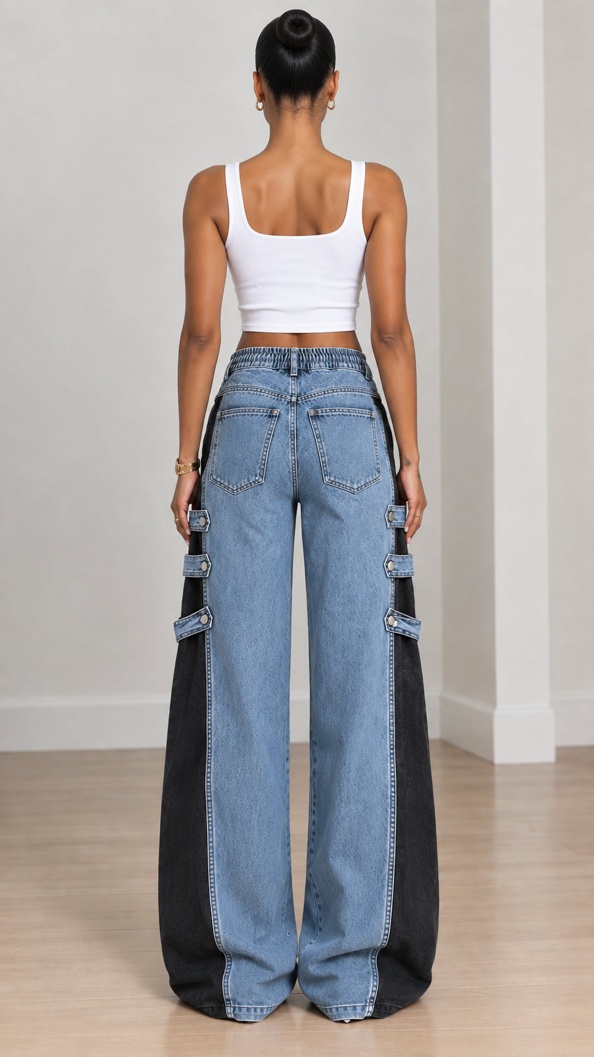 Back view of women wearing two-tone blue and black wide-leg denim pants