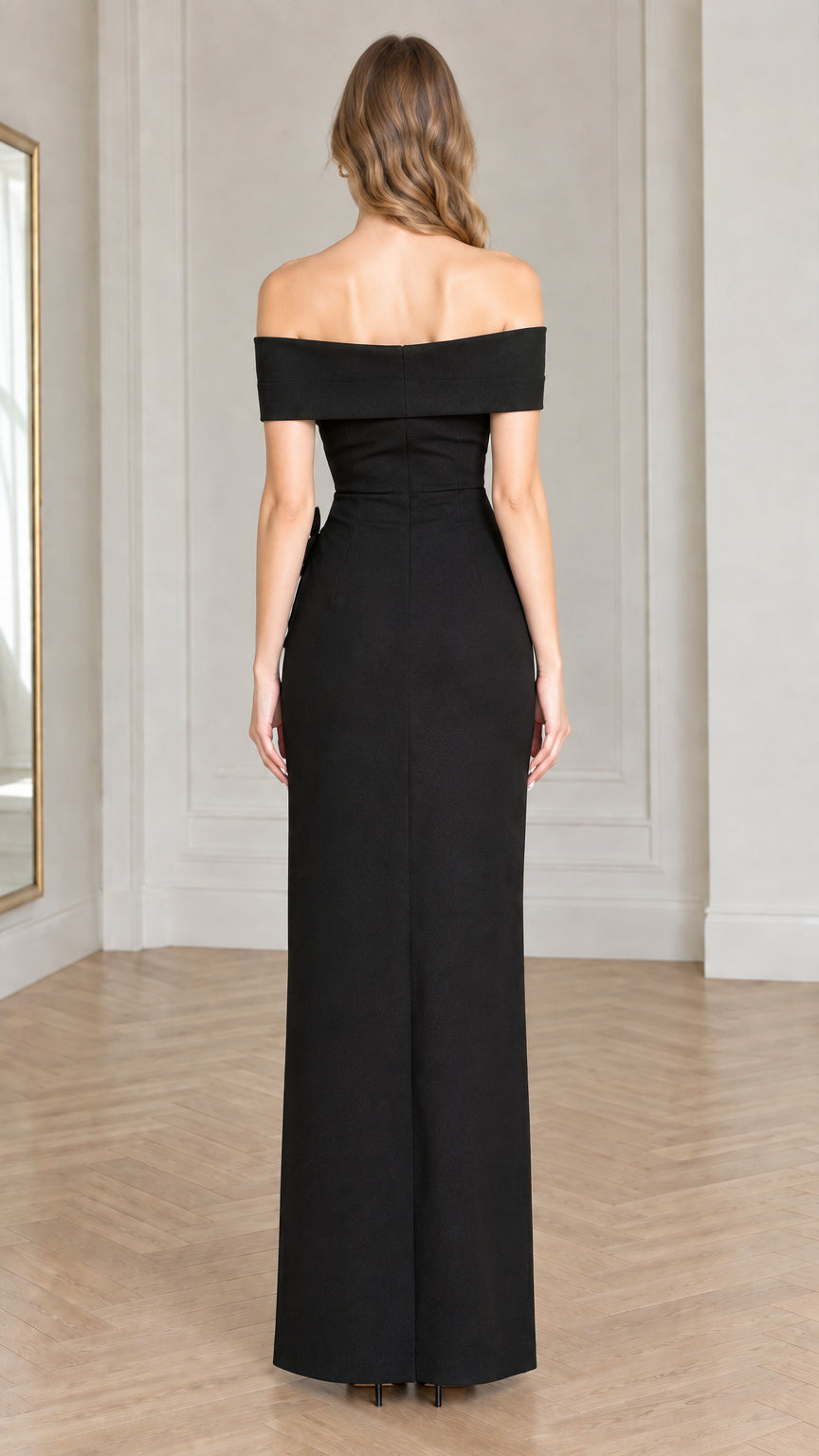Back view of model wearing the black maxi evening gown with back zip closure