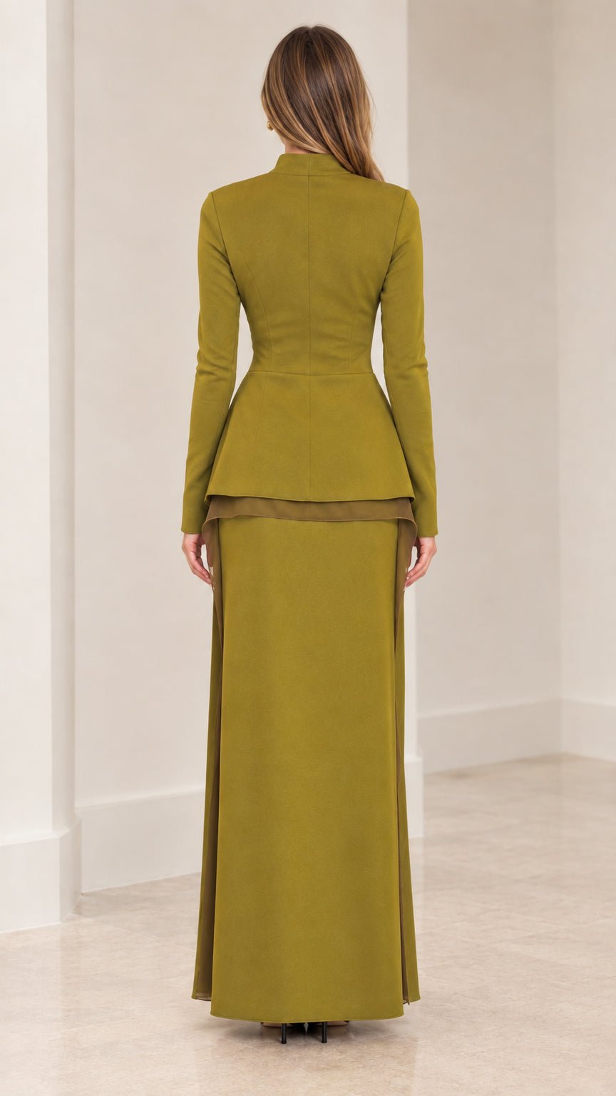 Back view of woman wearing olive green tailored long sleeve top and maxi skirt ensemble