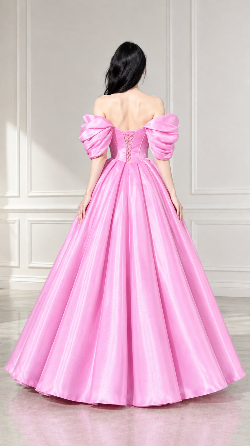 Back view of woman showing pink corset ball gown with lace-up back closure