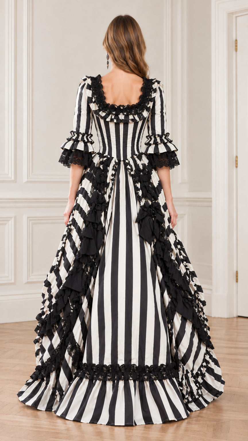 Rear view of black and white striped period dress highlighting fitted back bodice and sweeping skirt