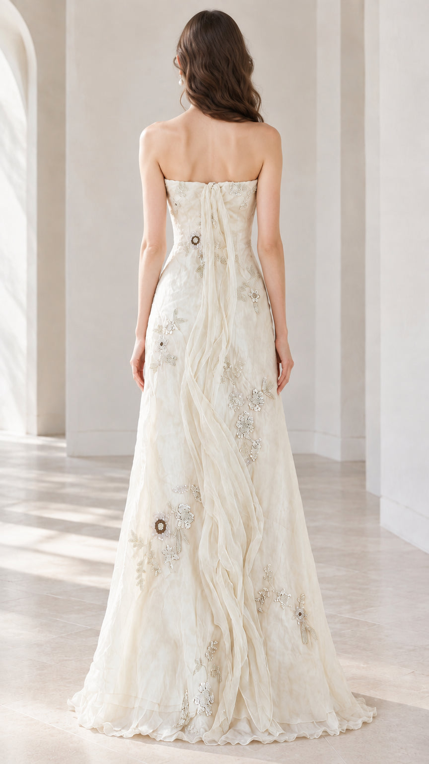Back view of ivory strapless evening gown highlighting clean back closure