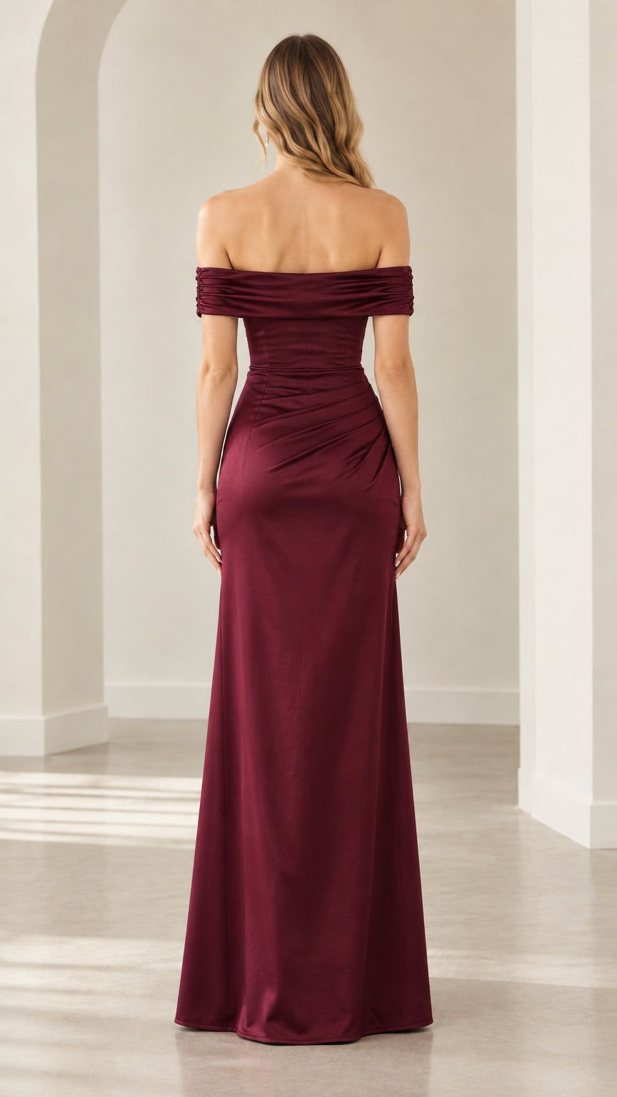 Back full-length view of woman wearing burgundy off-the-shoulder satin maxi dress