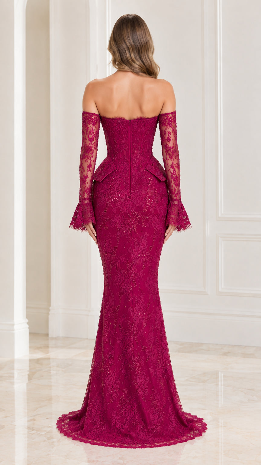 Back view of woman wearing magenta lace mermaid gown showing fitted back and train silhouette