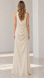 Back view of Champagne formal gown highlighting the draped cowl open back