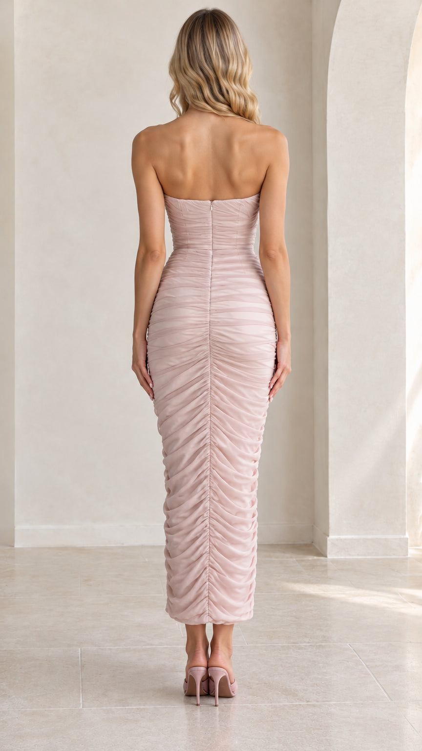Back view of strapless sweetheart ruched maxi dress in blush pink