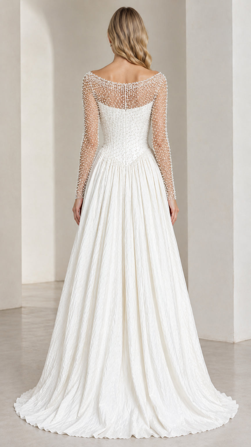 Back view of ivory white illusion pearl evening gown showing low scoop illusion back