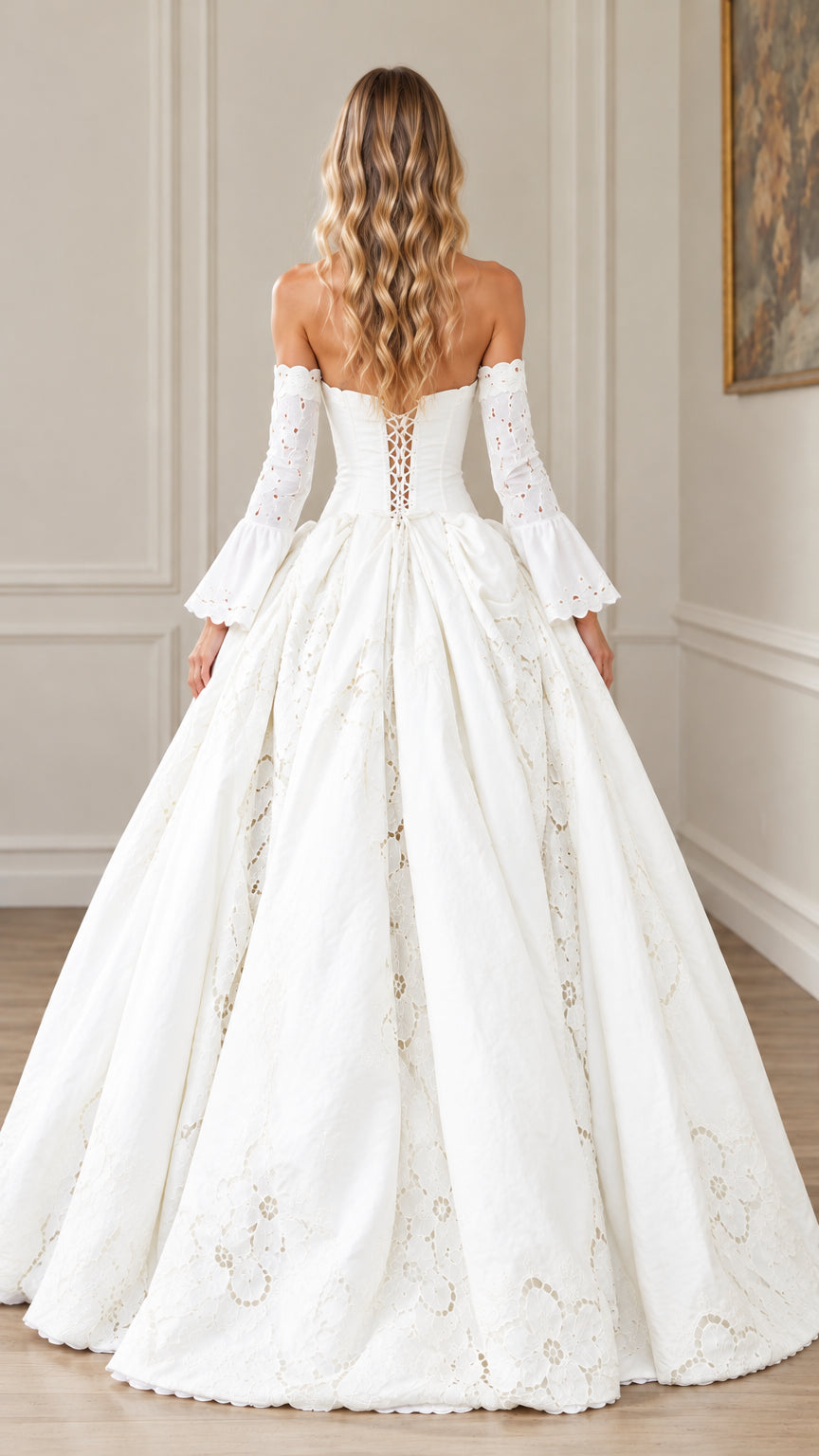 Back view of white corset ball gown highlighting lace-up bodice and full skirt