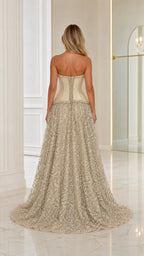 Back view of model wearing Champagne strapless corset evening gown showing train