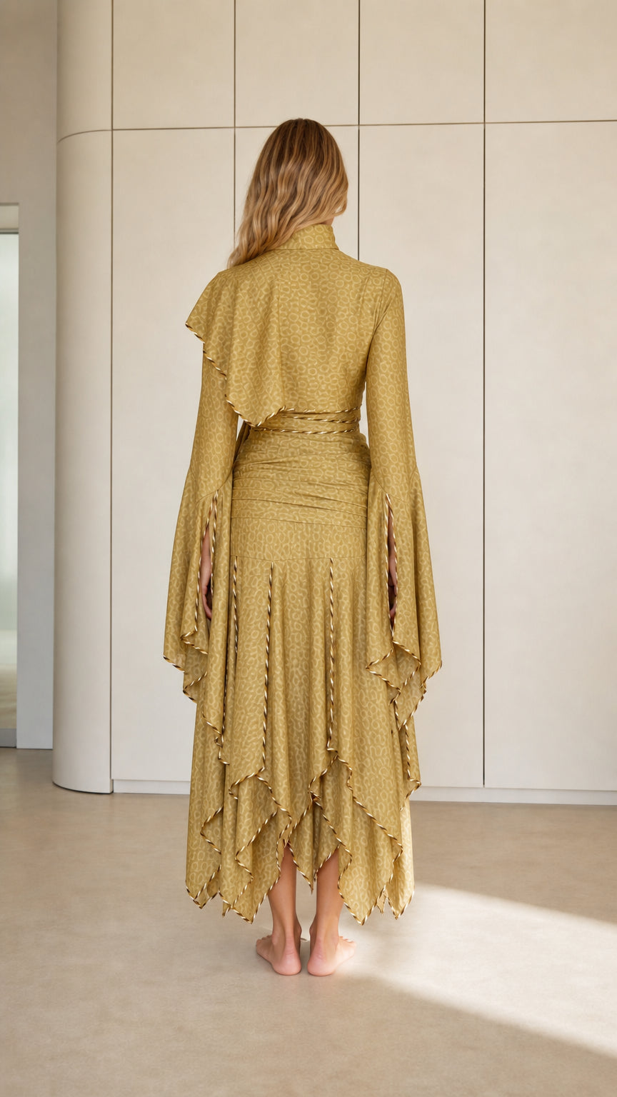Back view of Olive Gold long sleeve mock neck maxi dress with cascading layered skirt