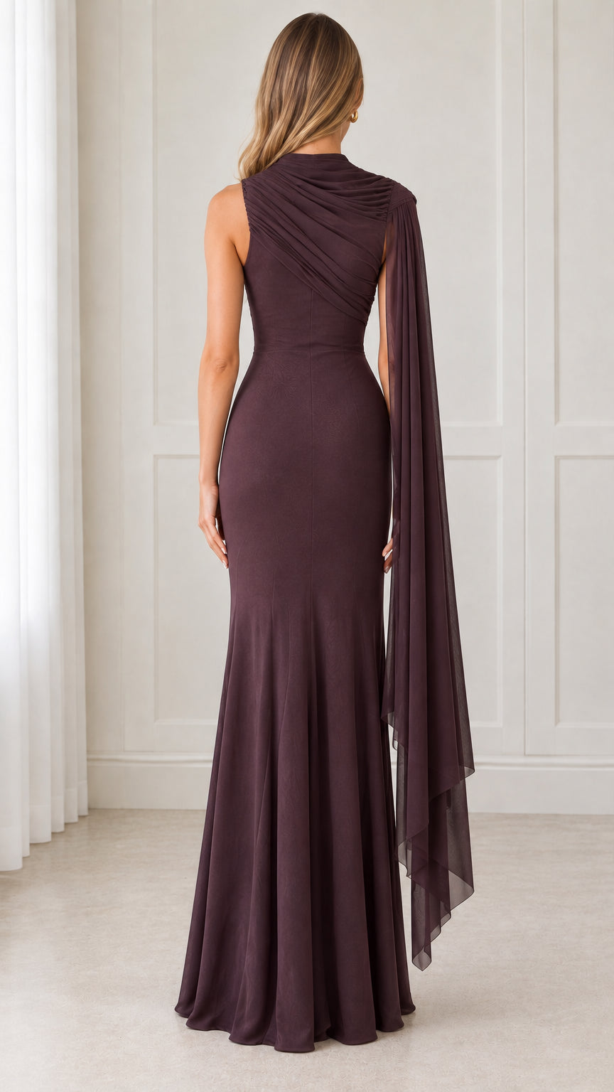Back view of model showing gathered shoulder and fitted back of plum maxi dress