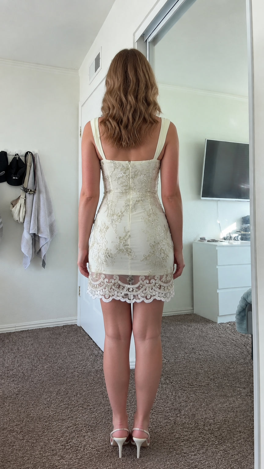 Back view of model wearing butter yellow sweetheart mini party dress