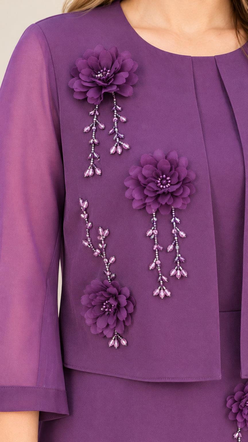 Close-up detail of 3D purple floral appliqués and beaded tassel drops on dress bodice