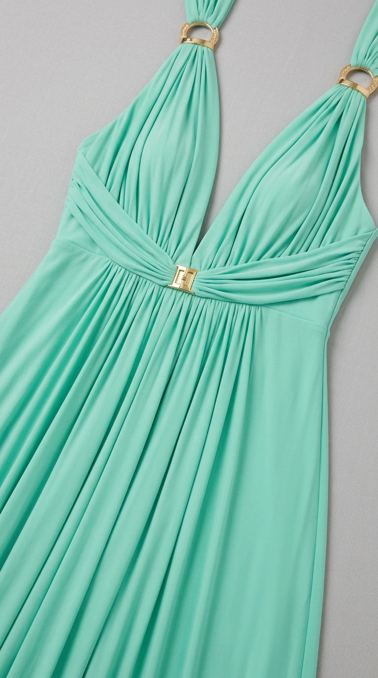 Close-up detail of mint green gathered V-neckline and gold-tone metallic hardware