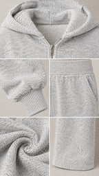 Close-up details of heather grey textured knit fabric, hood zipper, ribbed cuffs, and pants pockets