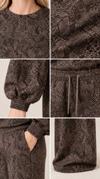 Close-up details of brown snakeskin loungewear fabric, neckline, elastic cuff, drawstring, and pockets