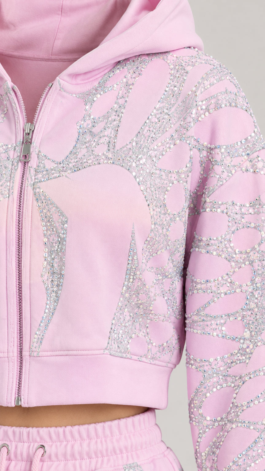 Close-up detail of zipper, hood, and sparkling rhinestone pattern on Light Pink jacket