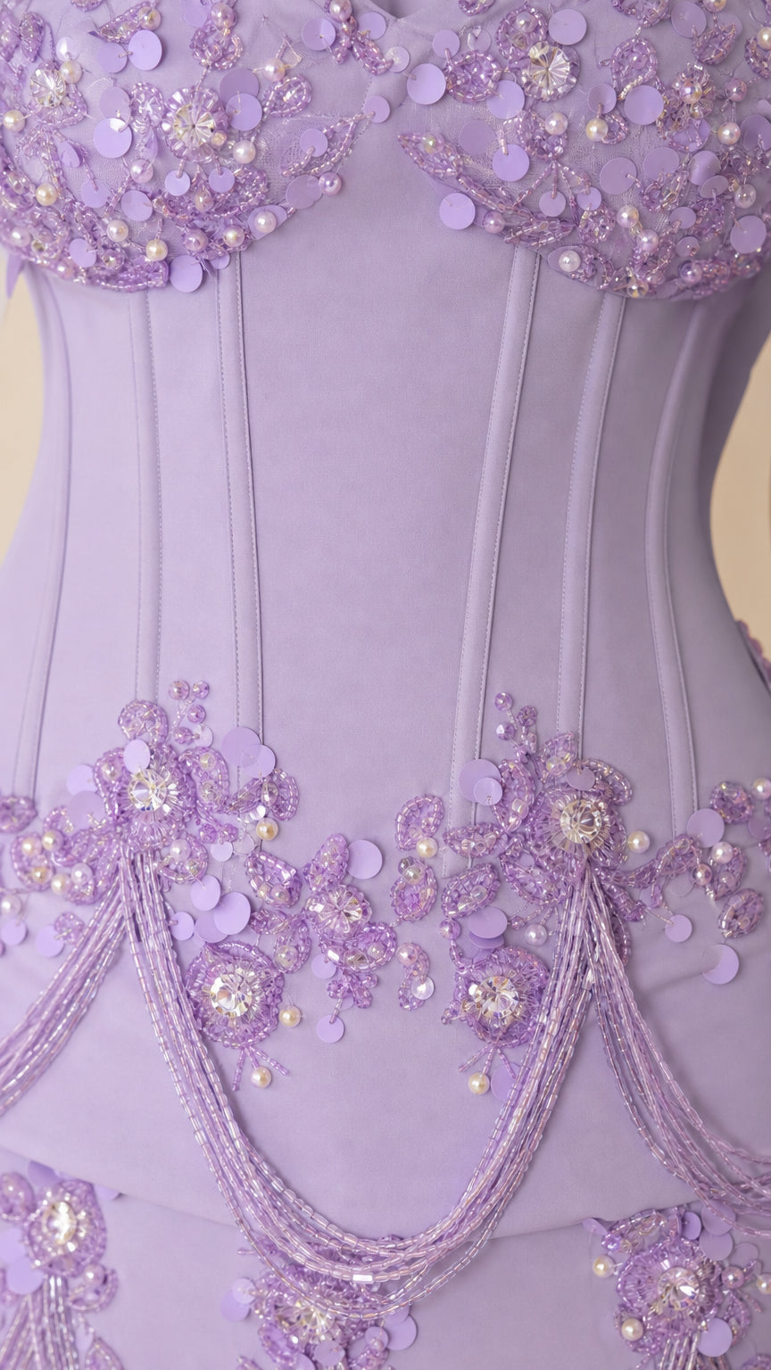 Close-up of boned corset bodice with 3D floral sequin appliqués and pearl beadwork
