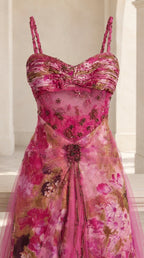 Close-up of ruched sweetheart bodice with intricate beading and floral print detail