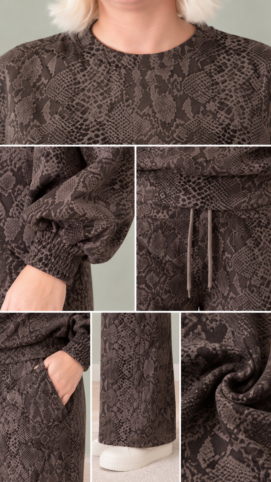 Close-up details of neckline, sleeve cuff, drawstring waistband, pocket, hem, and fabric texture