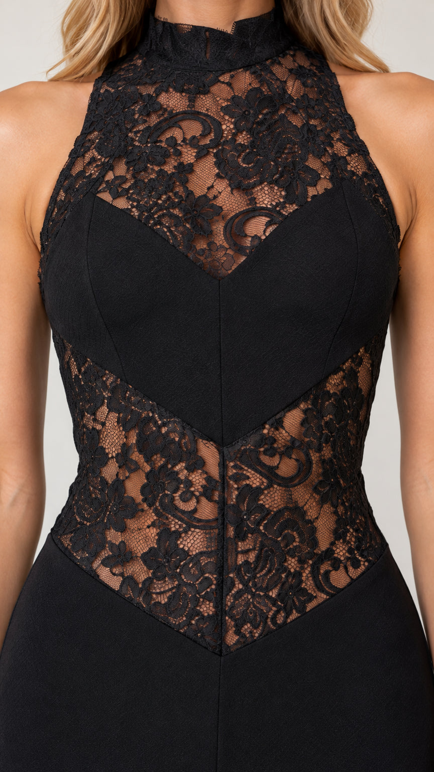 Close-up of intricate floral lace neckline and waist panels on black evening dress