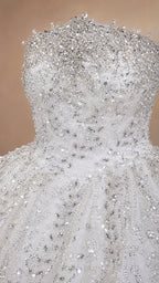 Close-up detail of silver white embellished strapless bodice with beads and crystals