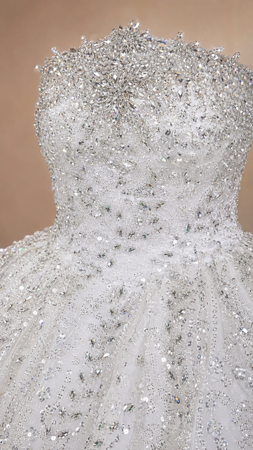 Close-up detail of silver white embellished strapless bodice with beads and crystals