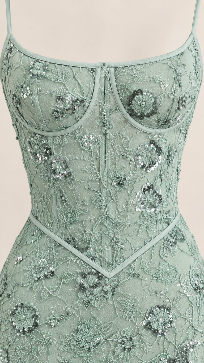 Close-up of sage green embroidered sequin bustier bodice and basque waist