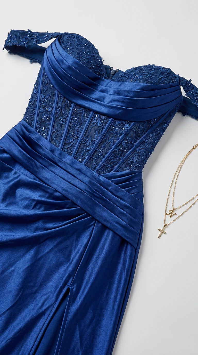 Flat lay close-up of royal blue corset bodice showing boning and beaded lace detailing
