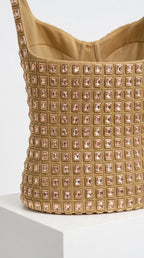 Close-up detail of structured bodice and square grid sequin embellishments