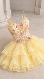 Detailed flat lay of the yellow floral embroidered boned bodice and tiered ruffle skirt