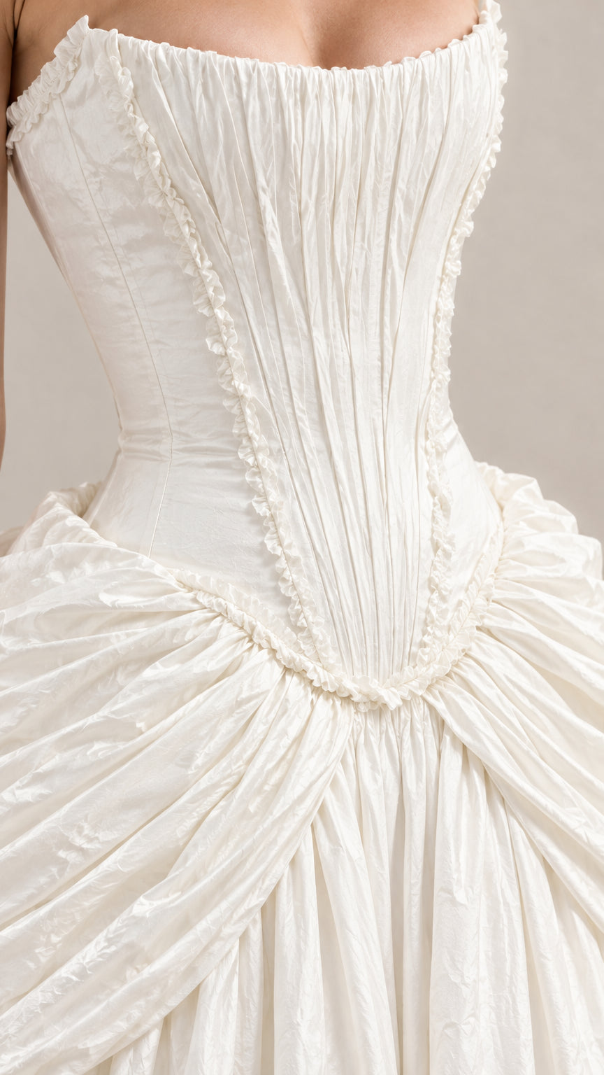 Close-up detail of structured pleated corset bodice and ruffled trim waistline