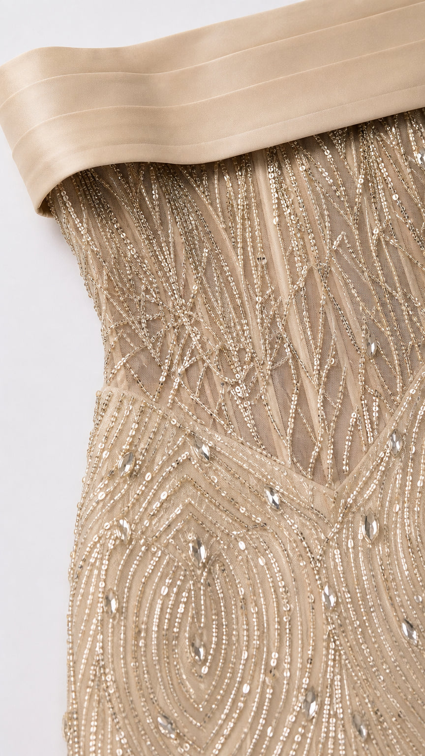 Close-up detail of bodice showing structured boning, intricate beadwork, and satin foldover neckline