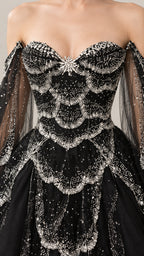 Close-up detail of ornate silver beaded embellishments on black sweetheart bodice