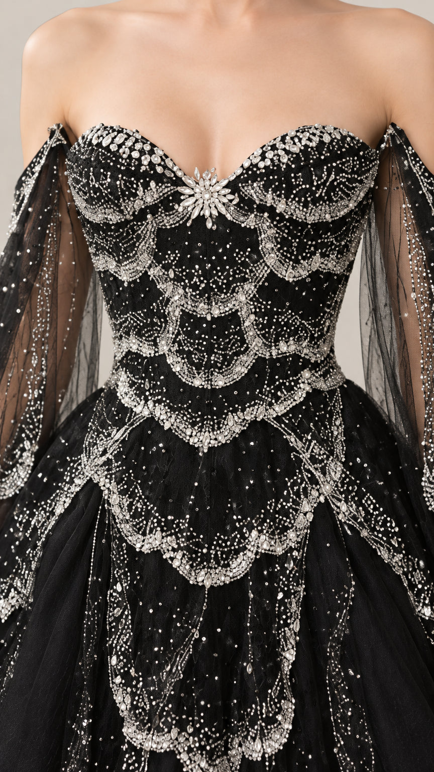 Close-up detail of ornate silver beaded embellishments on black sweetheart bodice