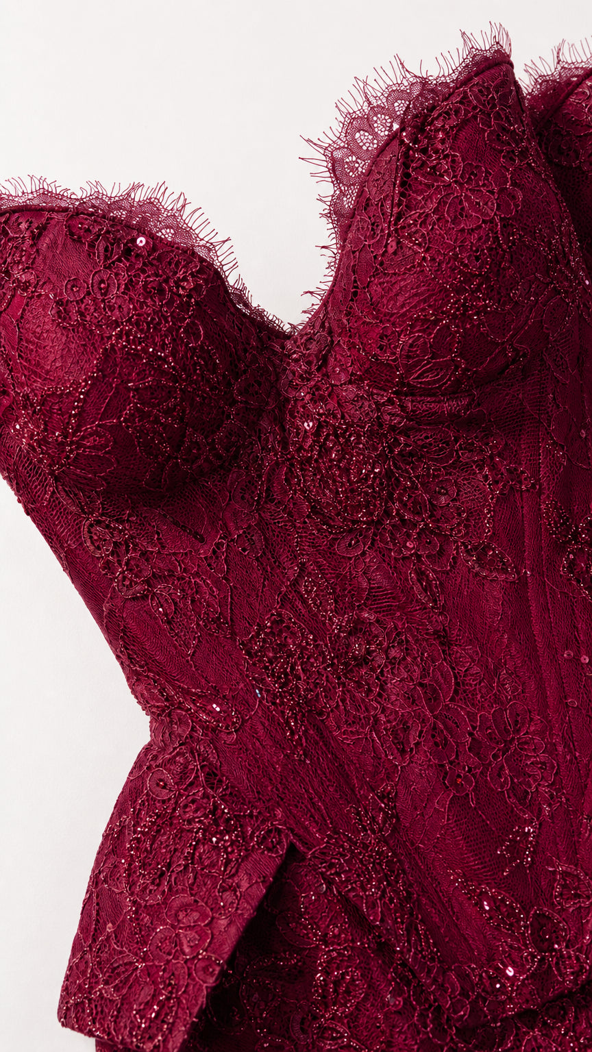 Close-up detail of burgundy embroidered lace bodice with sweetheart eyelash trim and beading