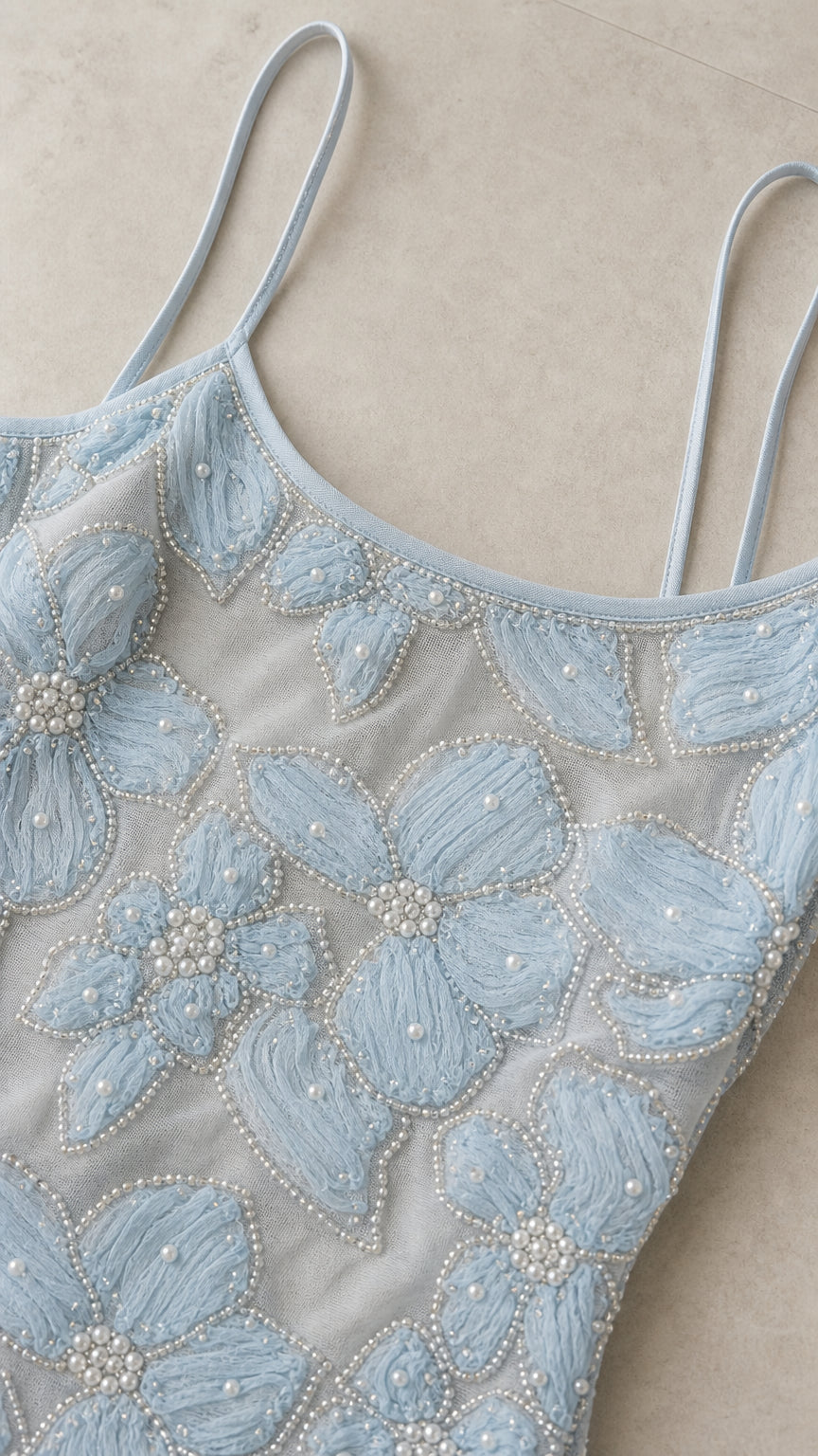 Close-up detail of Light Blue floral embroidery and delicate beadwork