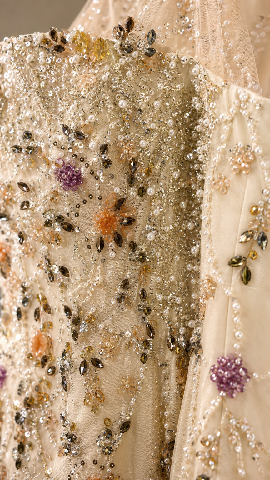 Close-up detail of multi-colored floral beading and crystal embellishments