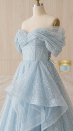 Close-up mannequin view of structured sweetheart bodice with draped off-the-shoulder sleeves