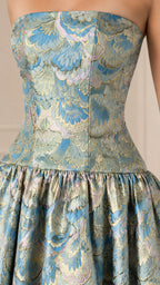 Close-up detail of textured light blue floral jacquard strapless bodice
