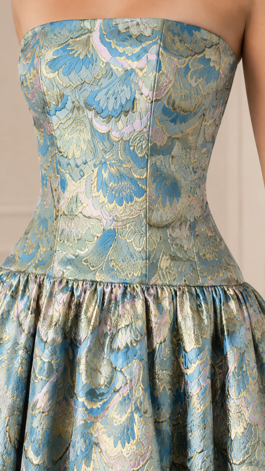 Close-up detail of textured light blue floral jacquard strapless bodice