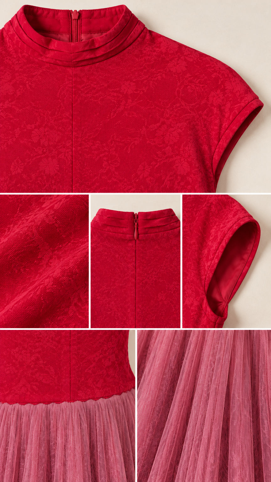 Close-up details of red floral jacquard bodice, mock neck collar, cap sleeve, and pleated skirt seam